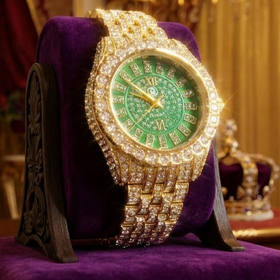 Luxury watch with green face and gold accents on a purple cushion in an opulent room.